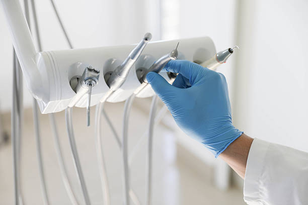 Professional Root Canal Treatment technician working in Bloomington, IL